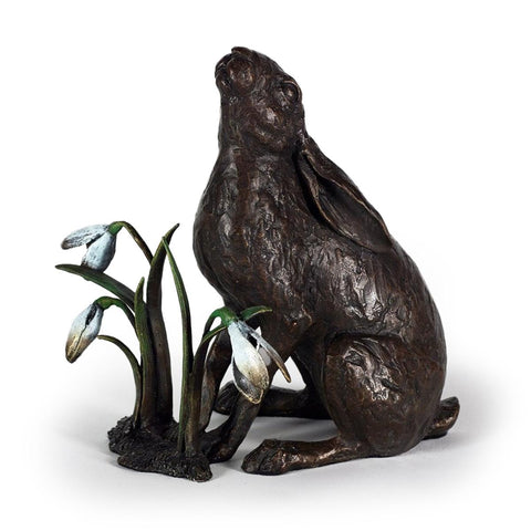 Spring Gaze by Michael Simpson - a solid bronze sculpture capturing a moon-gazing hare surrounded by delicate spring blooms
