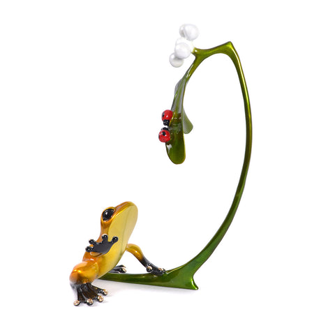 Misteltoe by Frogman Tim Cotterill - side profile of bronze sculpture gold frog reaches tentatively for two ruby red ladybugs cling to a sprig of mistletoe.