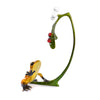 Misteltoe by Frogman Tim Cotterill - side profile of bronze sculpture gold frog reaches tentatively for two ruby red ladybugs cling to a sprig of mistletoe.